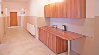 a kitchen with a wooden counter top in a room at Ośrodek Wczasowy Jodła in Zawoja