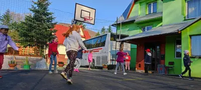 a group of people playing basketball on a street at Ośrodek Wczasowy Jodła in Zawoja