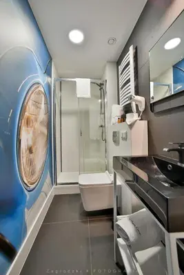 a bedroom with a large bed and a desk at Saint Thomas Corner - by Upstairs in Kraków