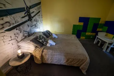 a bedroom with a large bed in a room with at Willa Sulimówka - wyjątkowy dom na wyłączność Mini SPA in Zakliczyn