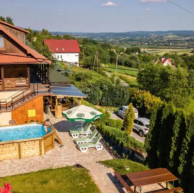 an overhead view of a swimming pool and a house at Willa Sulimówka - wyjątkowy dom na wyłączność Mini SPA in Zakliczyn