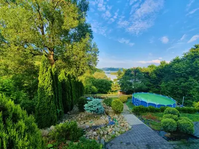 an aerial view of a garden with a tent at Dom nad Jeziorem Rożnowskim in Tęgoborze