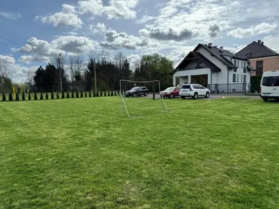 a soccer field with a net in the grass at Apartamenty ZATOR20 2 min od Energylandii in Zator