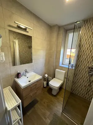 a bathroom with a toilet and a sink and a shower at Apartamenty ZATOR20 2 min od Energylandii in Zator