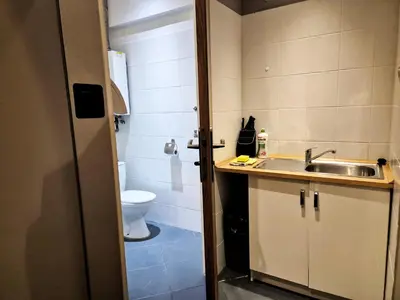 a small bathroom with a sink and a toilet at Main Square 18 view 2 in Kraków