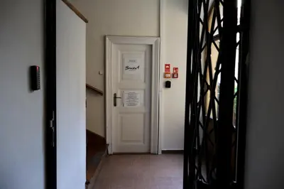 a bedroom with a bed with two towels on it at Bracka 4 Apartament in Kraków