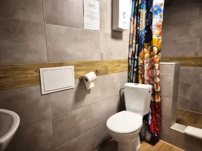 a small room with a bed and a couch at Bracka 4 Apartament in Kraków