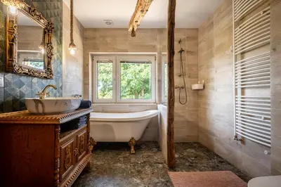 a bathroom with a tub and a sink and a window at Orzechowa Ostoja noclegi Energylandia in Bachowice