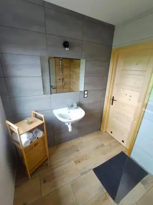 an overhead view of a bathroom with a sink at Happy Holiday domki Zator in Zator