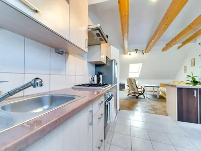 a kitchen with a sink and a stove at Apartment Królowej Jadwigi by Interhome in Kraków