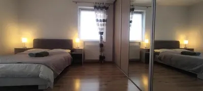 a living room with a couch and a table at Pleasant private and fully equipped apartment with private parking space close to District Kazimierz in Kraków