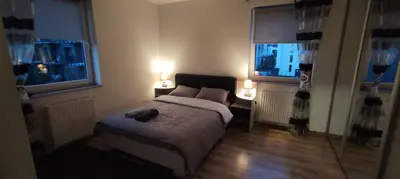 a small kitchen with a table in the middle of it at Pleasant private and fully equipped apartment with private parking space close to District Kazimierz in Kraków