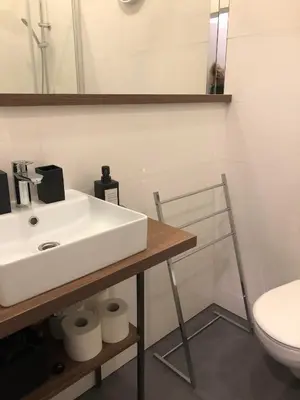 a bathroom with a white sink and a toilet at NEW APARTMENT! Jewish quarter - SEGUNDO in Kraków