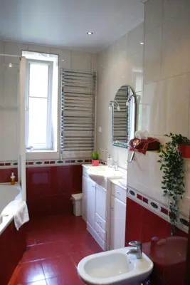 a bathroom with a sink and a toilet and a tub at Villa For You in Oświęcim
