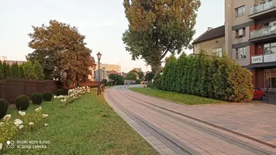 a brick road next to a building at Wieliczka City Apartments in Wieliczka