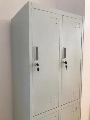 a locker room with white cabinets in a room at VIKI Kazimierz in Kraków