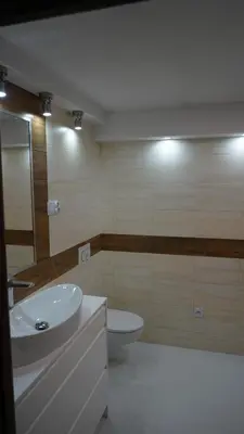 a bathroom with a sink and a toilet at DOM NA SKARPIE in Mszana Górna
