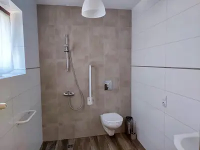 a bathroom with a toilet and a shower at Eko Dworek tylko 1500m do wejścia Energylandii in Zator