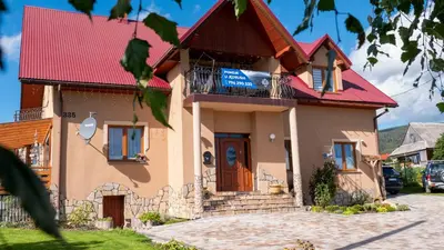 a house with a red roof at U Jędrusia in Zubrzyca Górna