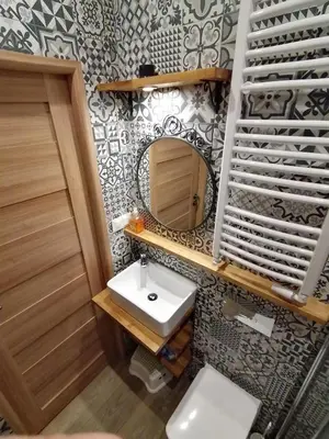 a bathroom with a sink and a mirror at Studio Krakow old town apartment in Kraków