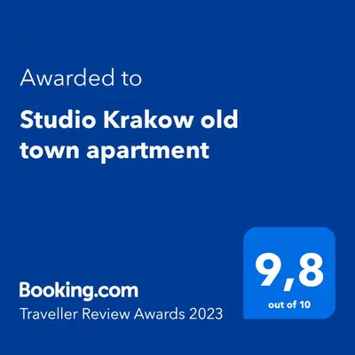 a screenshot of a phone with the text awarded to studio krakow old town at Studio Krakow old town apartment in Kraków
