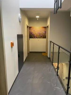 an empty hallway with a painting on the wall at Sunflower Apartment Old Town in Kraków