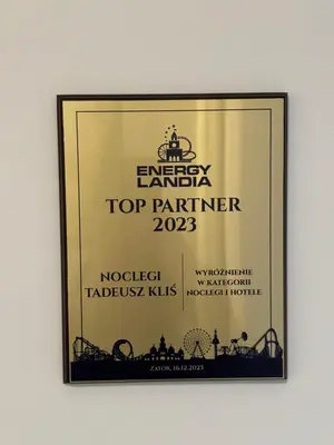 a framed picture of a top partner sign on a wall at Noclegi u Tadka in Zator