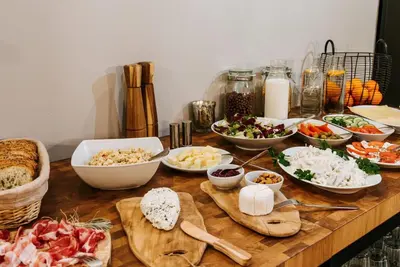 a table topped with bowls of food and vegetables at Gorczańskie Zacisze in Lubomierz