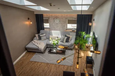 a living room with a couch and a table at Szpitalna 9 Residence in Kraków