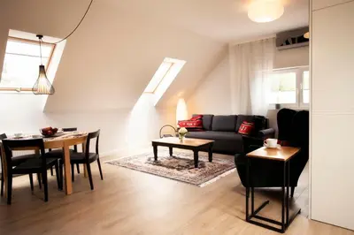 a living room with a couch and a table at Solny Domek Salt House in Wieliczka
