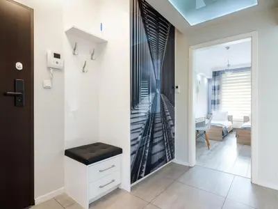 a room with a staircase and a living room at Golden Queen Apartments Jewish District in Kraków