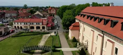 a view of a town with a bridge and buildings at Pokoje Gościnne z łazienkami in Niepołomice