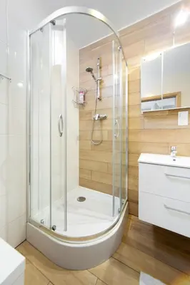 a bathroom with a shower with a glass door at Cozy modern Apartment ASTORIA MAGIC GREY OLD TOWN in Kraków