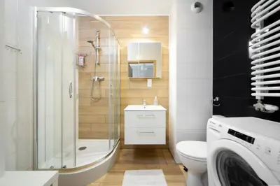 a bathroom with a shower and a toilet and a sink at Cozy modern Apartment ASTORIA MAGIC GREY OLD TOWN in Kraków