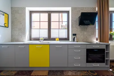 a kitchen with a sink and a window at Carp&Bed Zator in Zator