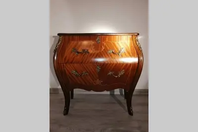 a wooden dresser sitting in a room at Nad Strumykiem in Mszana Dolna