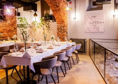 a long table in a room with chairs and tables at Hotel Estera in Kraków