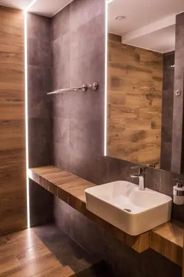 a bathroom with a white sink and a mirror at Hotel Rancho Pcim in Pcim