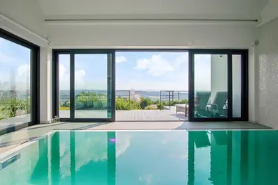 a swimming pool in a house with a view at villa relax with swimming pool and mountain view in Buków