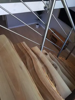 a close up of a wooden surfboard on the floor at Kameralny in Przeciszów