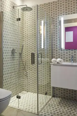a bathroom with a shower and a toilet at 7 HEAVEN Elegant Rooms KRAKÓW Old Town in Kraków