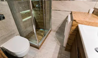 a bathroom with a shower and a toilet and a sink at Cozy rooms in Old Town and Wawel in Kraków