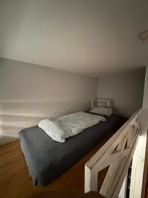 a bed in a small room with at Cozy rooms in Old Town and Wawel in Kraków