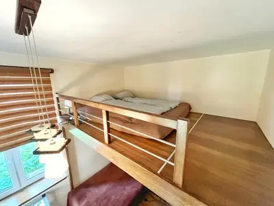 a bedroom with a bunk bed in a house at Cozy rooms in Old Town and Wawel in Kraków