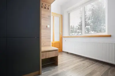 a room with a window and a wooden floor at Apartament z ogrodem w centrum Limanowej in Limanowa