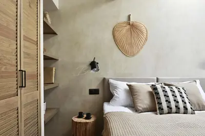 a bedroom with a bed with a heart on the wall at Betty's Place in Zabierzów