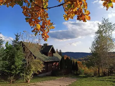 a house with a green roof in the mountains at Dom Na Wzgórzu 479, The House on the hill in Sułkowice
