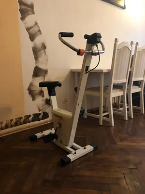 a stand up exercise machine next to a table at Adam12 in Kraków