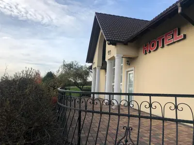 a hotel sign on the side of a building at Hotel Arkadia in Klecza Górna