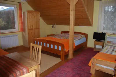 a kitchen with a sink and a stove and a window at Gosidomek in Zawoja